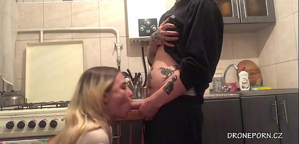  Young couple having sex in the kitchen